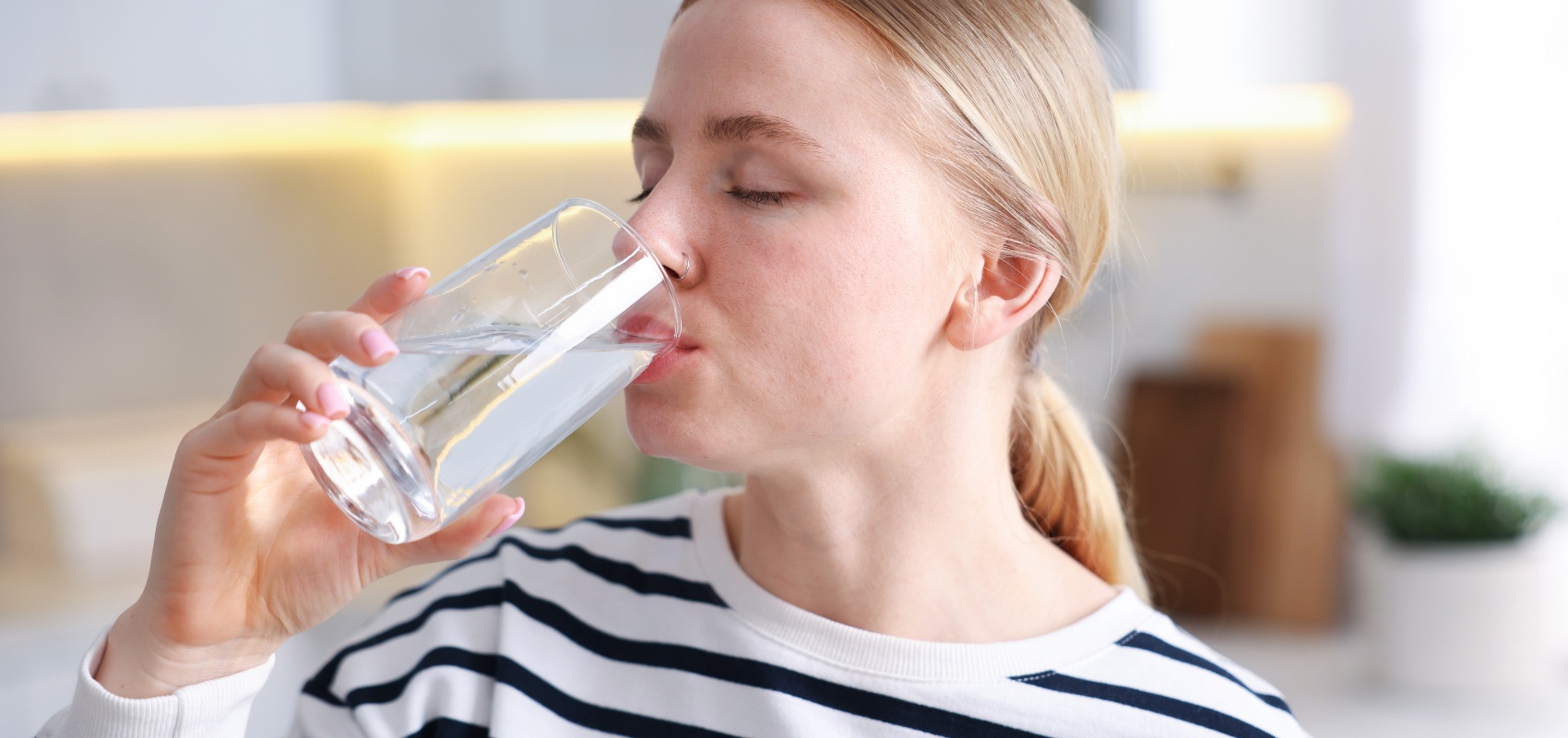 drinking a glass of water